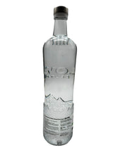 Clear bottle with a label on a white background